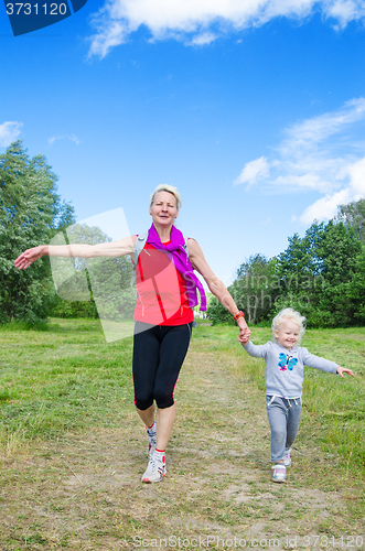 Image of A woman with a child on the sports outing