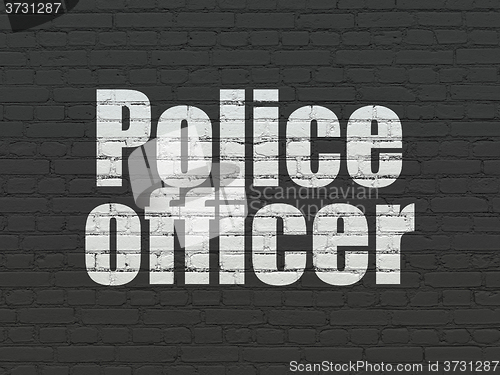 Image of Law concept: Police Officer on wall background