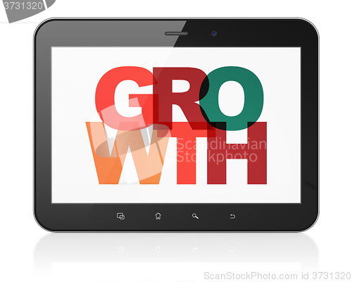 Image of Finance concept: Tablet Computer with Growth on  display