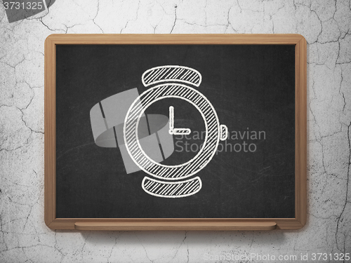 Image of Timeline concept: Hand Watch on chalkboard background