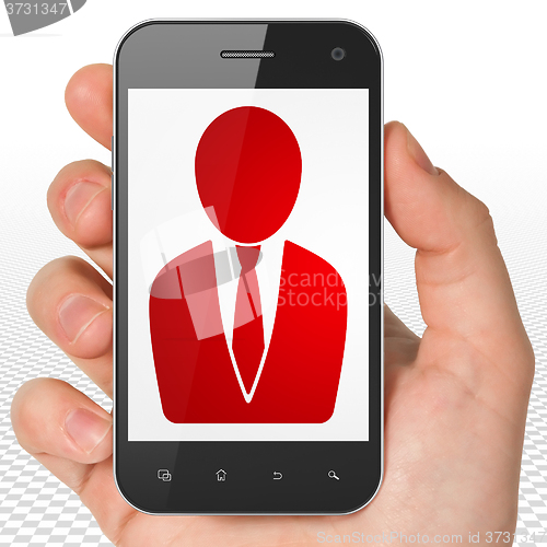 Image of Law concept: Hand Holding Smartphone with Business Man on display
