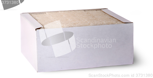 Image of In front white sugar cubes in a box