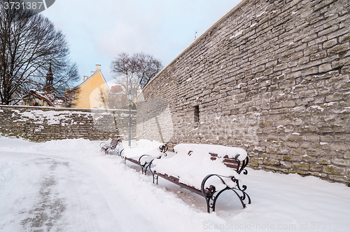 Image of Bench and street lamp in the park winter Old Tallinn