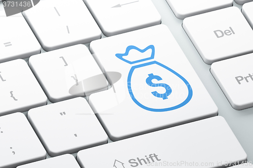Image of Currency concept: Money Bag on computer keyboard background