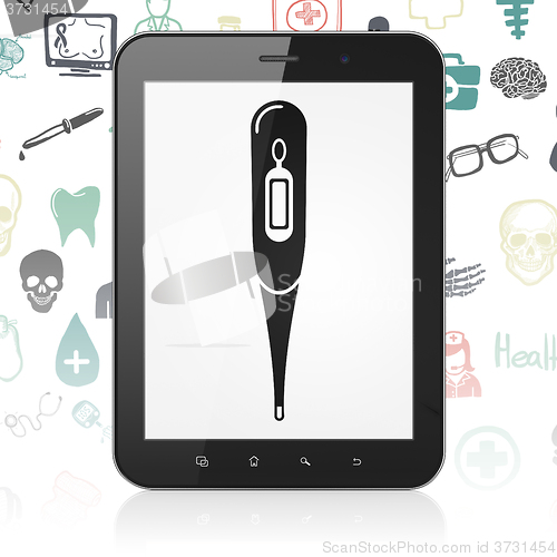 Image of Medicine concept: Tablet Computer with Thermometer on display