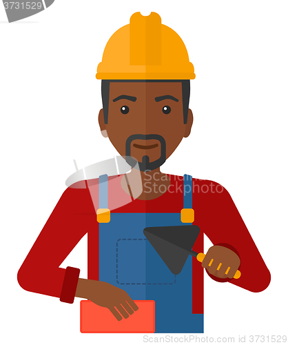 Image of Bricklayer with spatula and brick.