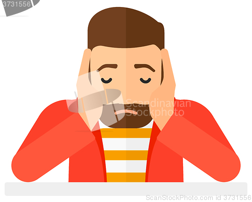 Image of Anxious man clutching his head.