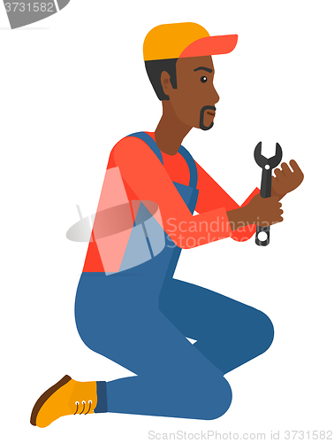 Image of Repairman holding spanner.
