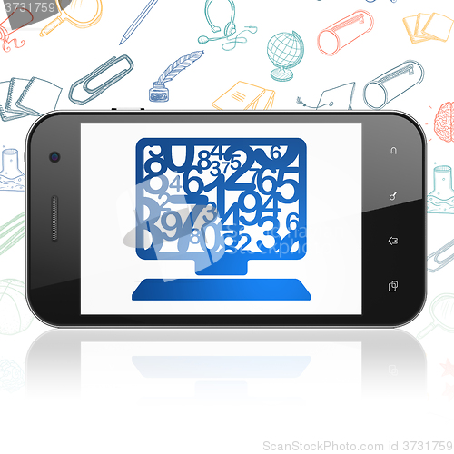 Image of Education concept: Smartphone with Computer Pc on display