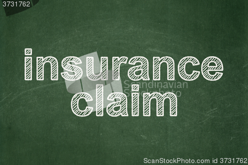 Image of Insurance concept: Insurance Claim on chalkboard background