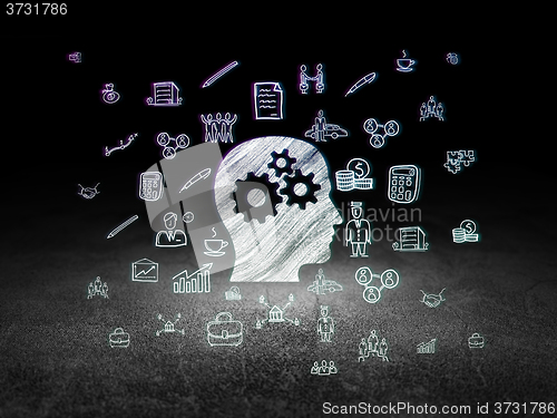 Image of Finance concept: Head With Gears in grunge dark room