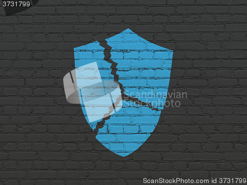 Image of Privacy concept: Broken Shield on wall background