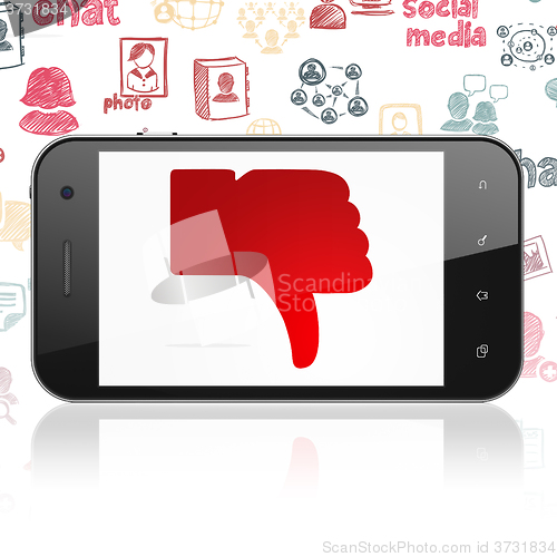 Image of Social media concept: Smartphone with Thumb Down on display