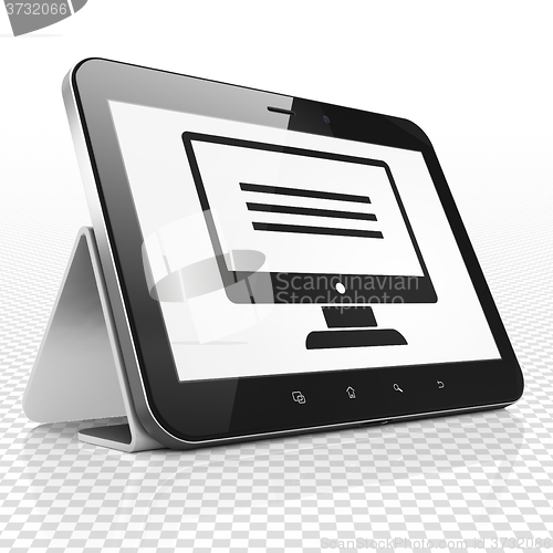 Image of Web development concept: Tablet Computer with Monitor on display