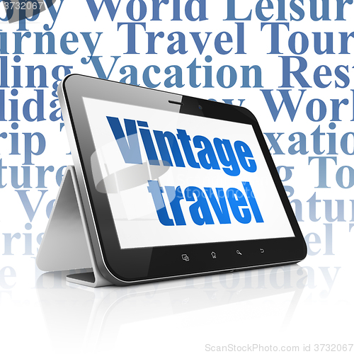 Image of Vacation concept: Tablet Computer with Vintage Travel on display