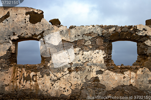 Image of brown distorted  window in a broke paint anzarote spain