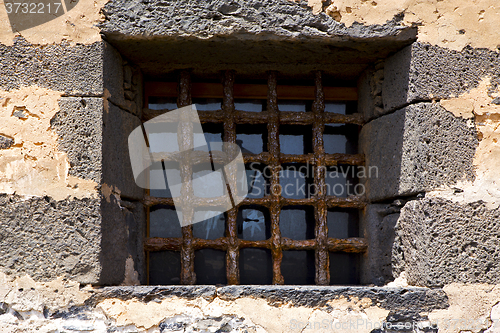 Image of brown distorted  castle window   broke   wall arrecife lanzarote