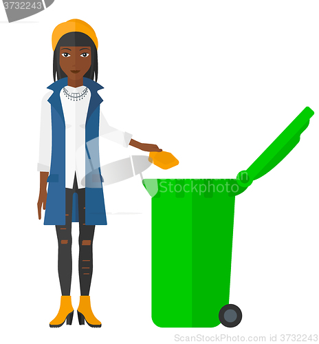 Image of Woman throwing trash.