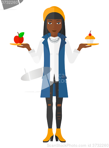 Image of Woman with apple and cake.