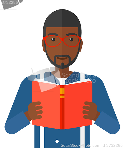 Image of Man reading book.