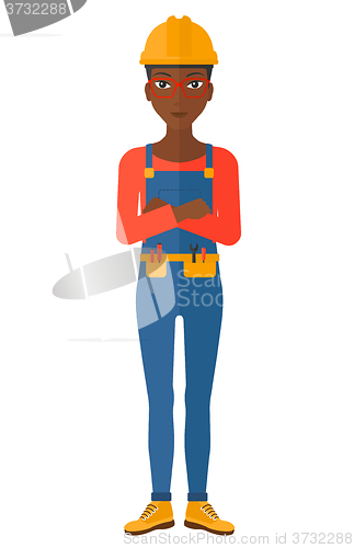 Image of Friendly builder with arms crossed.