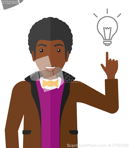 Image of Man pointing at light bulb.