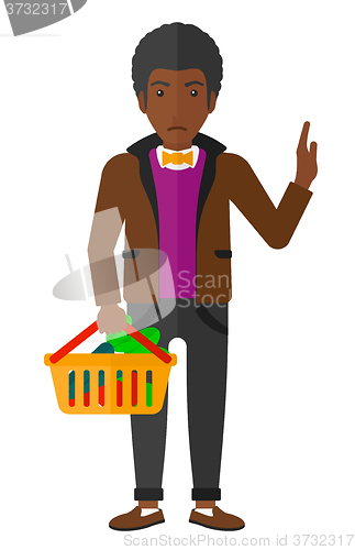 Image of Man holding supermarket basket.