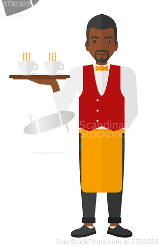 Image of Waiter holding tray with beverages.