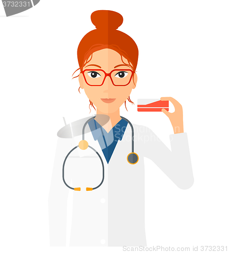 Image of Pharmacist showing some medicine.