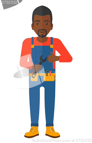 Image of Cheerful repairman with spanner.