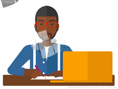 Image of Man using laptop for education.