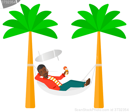 Image of Man chilling in hammock.