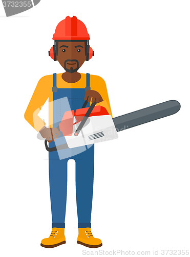 Image of Cheerful lumberjack with chainsaw.