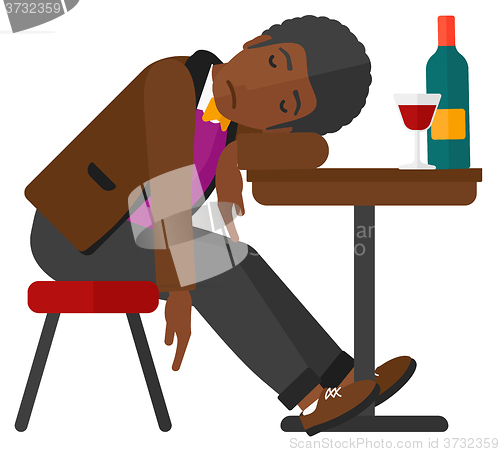 Image of Man sleeping in bar. 