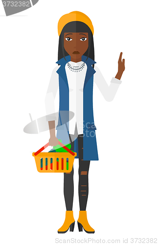 Image of Woman holding supermarket basket.