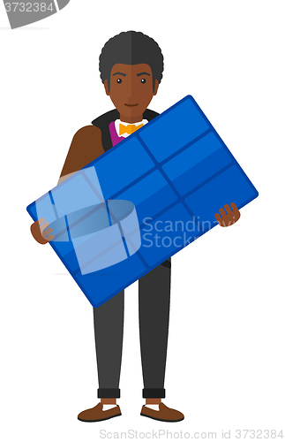 Image of Man holding solar panel.