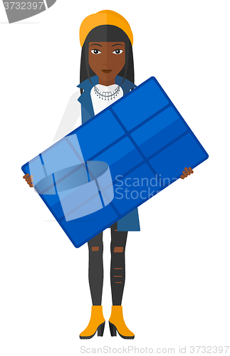 Image of Woman holding solar panel.