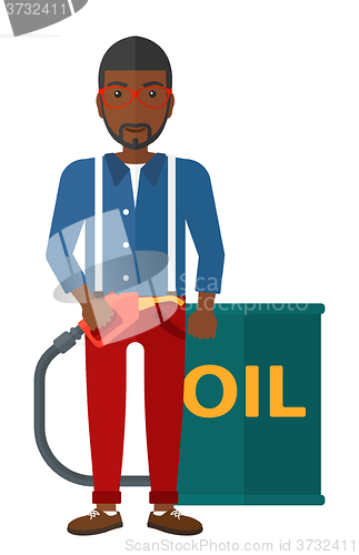 Image of Man with oil can and filling nozzle.