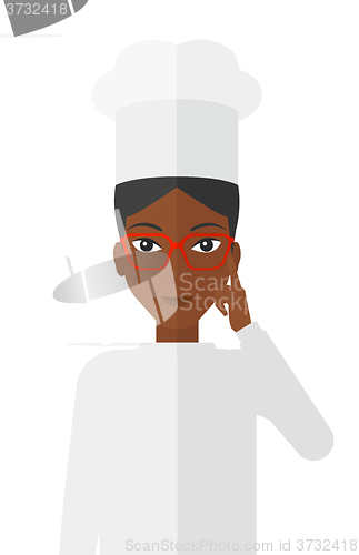 Image of Chef pointing forefinger up.