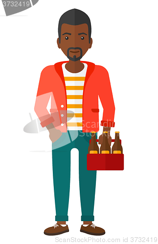 Image of Man with pack of beer.