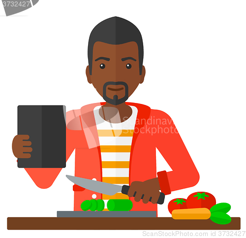 Image of Man cooking meal.