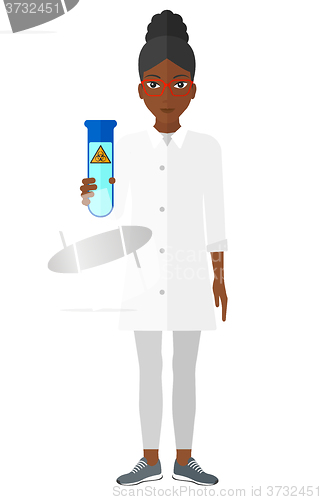 Image of Laboratory assistant with test tube.