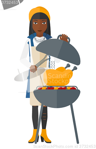 Image of Woman preparing barbecue.