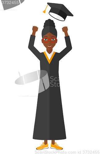 Image of Graduate throwing up her hat.