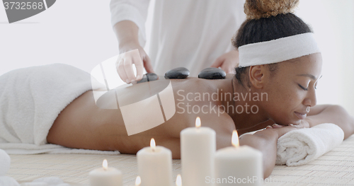 Image of Woman Getting Hot Stone Massage