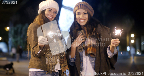 Image of Attractive young women having fun at Christmas