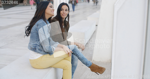 Image of Two trendy young women relaxing