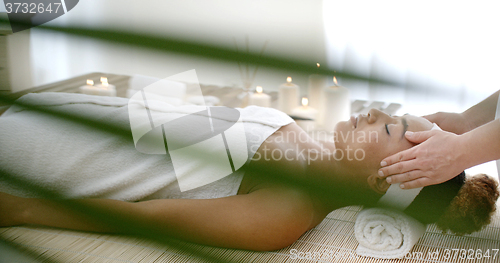 Image of Female Getting A Head Massage