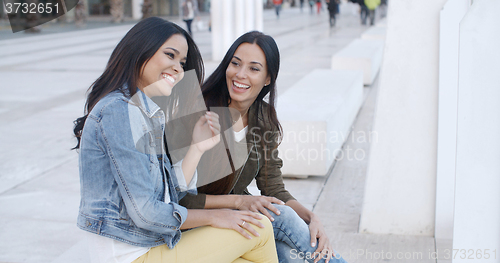 Image of Two trendy young women relaxing