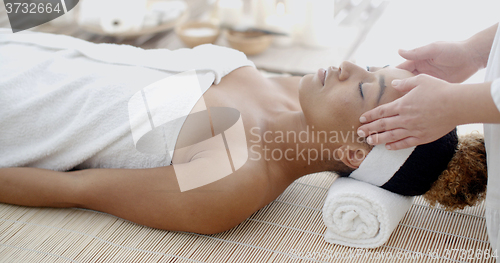 Image of Woman Taking Head Massage